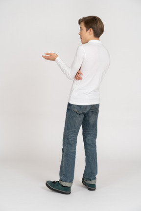 Young man in casual clothes standing