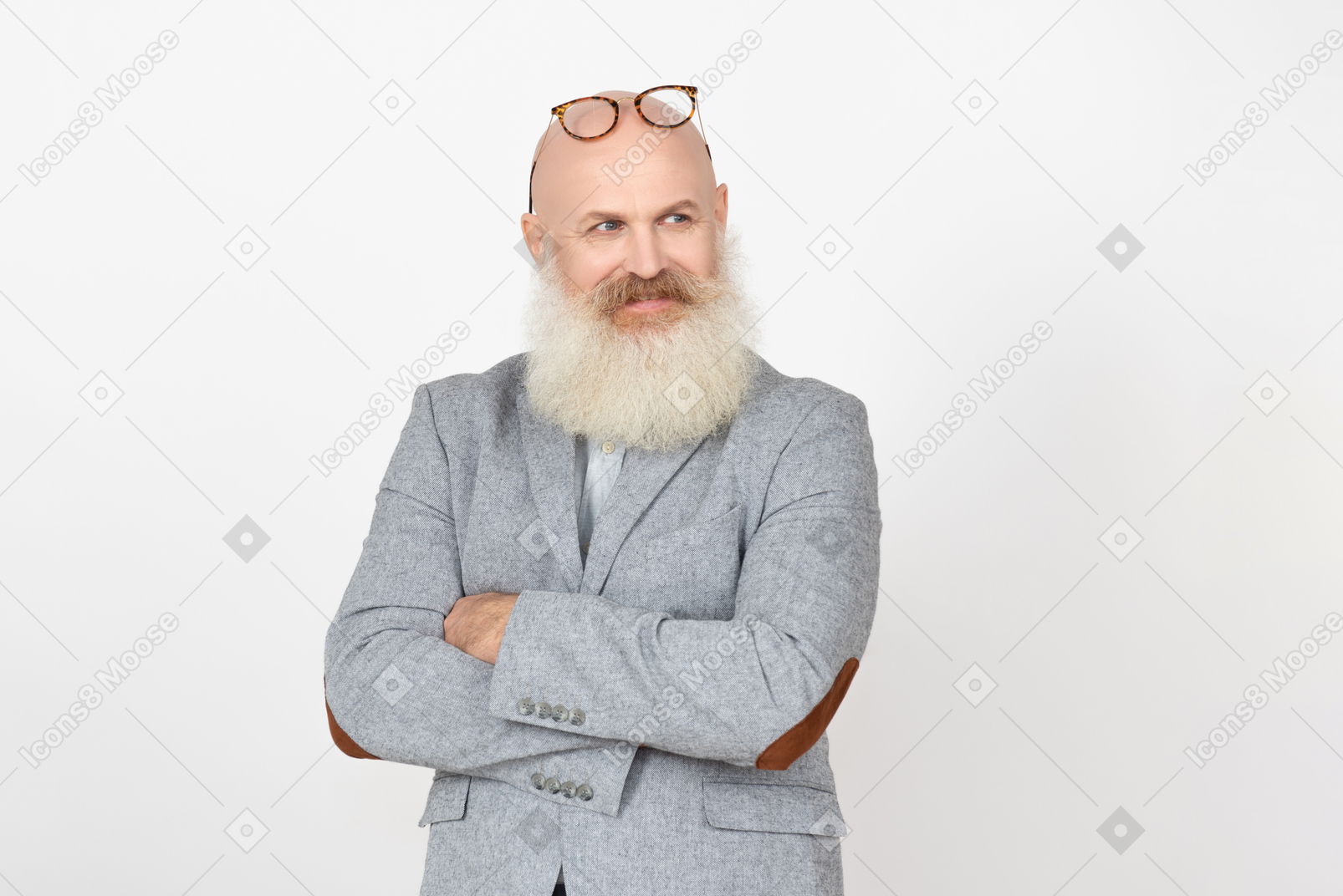 Distracted mature professor with his eyeglasses on head and hands folded