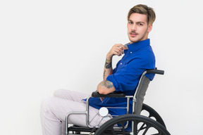 Young handsome man in a wheelchair
