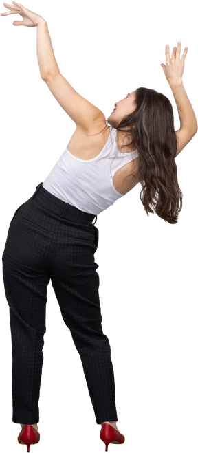 Back view of a young female in office clothing raising hands and tilting body