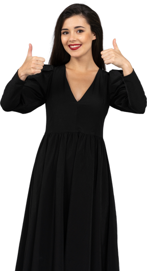 Front view of a young lady in a black dress showing thumbs up