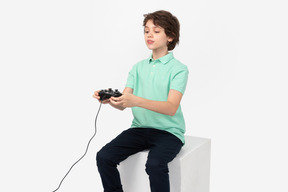 Teen boy playing video games