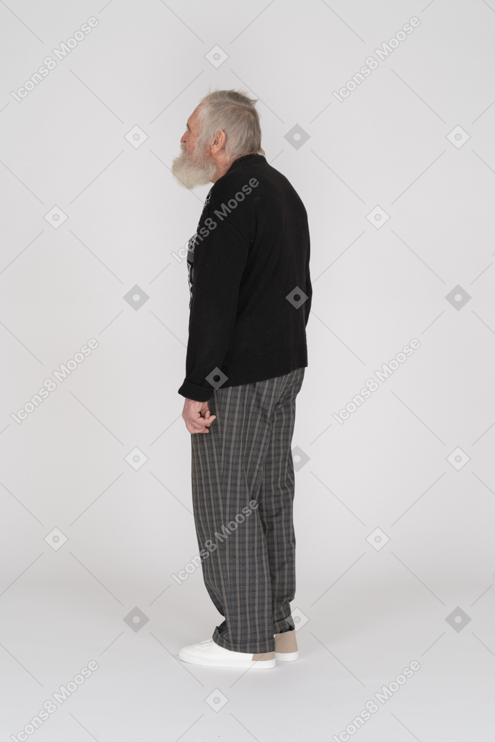 Side view of an old man in black sweater