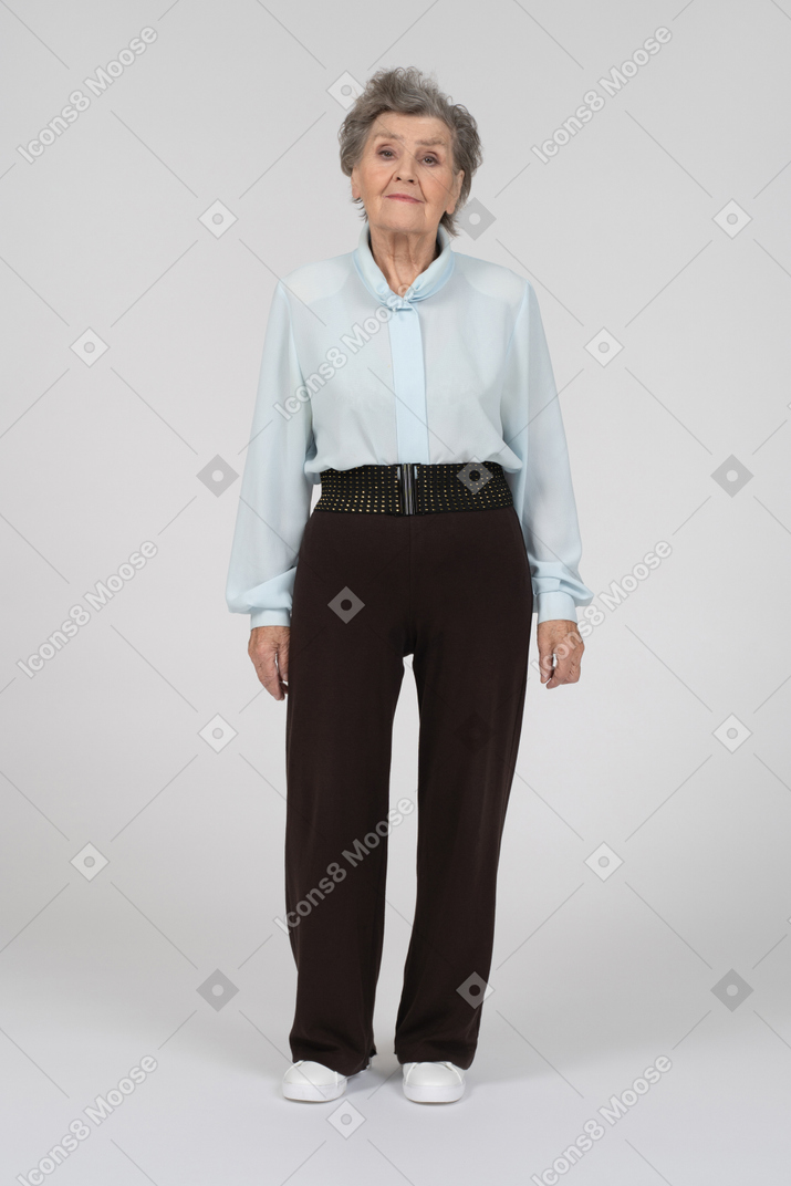 Old lady standing and looking at camera