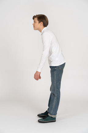 Young man in casual clothes standing