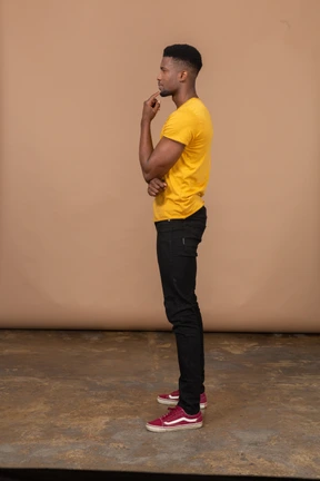 Side view of pensive young man
