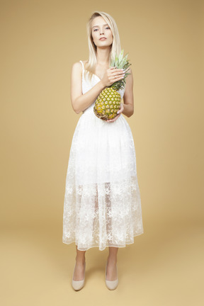 Beautiful bride holding a pineapple