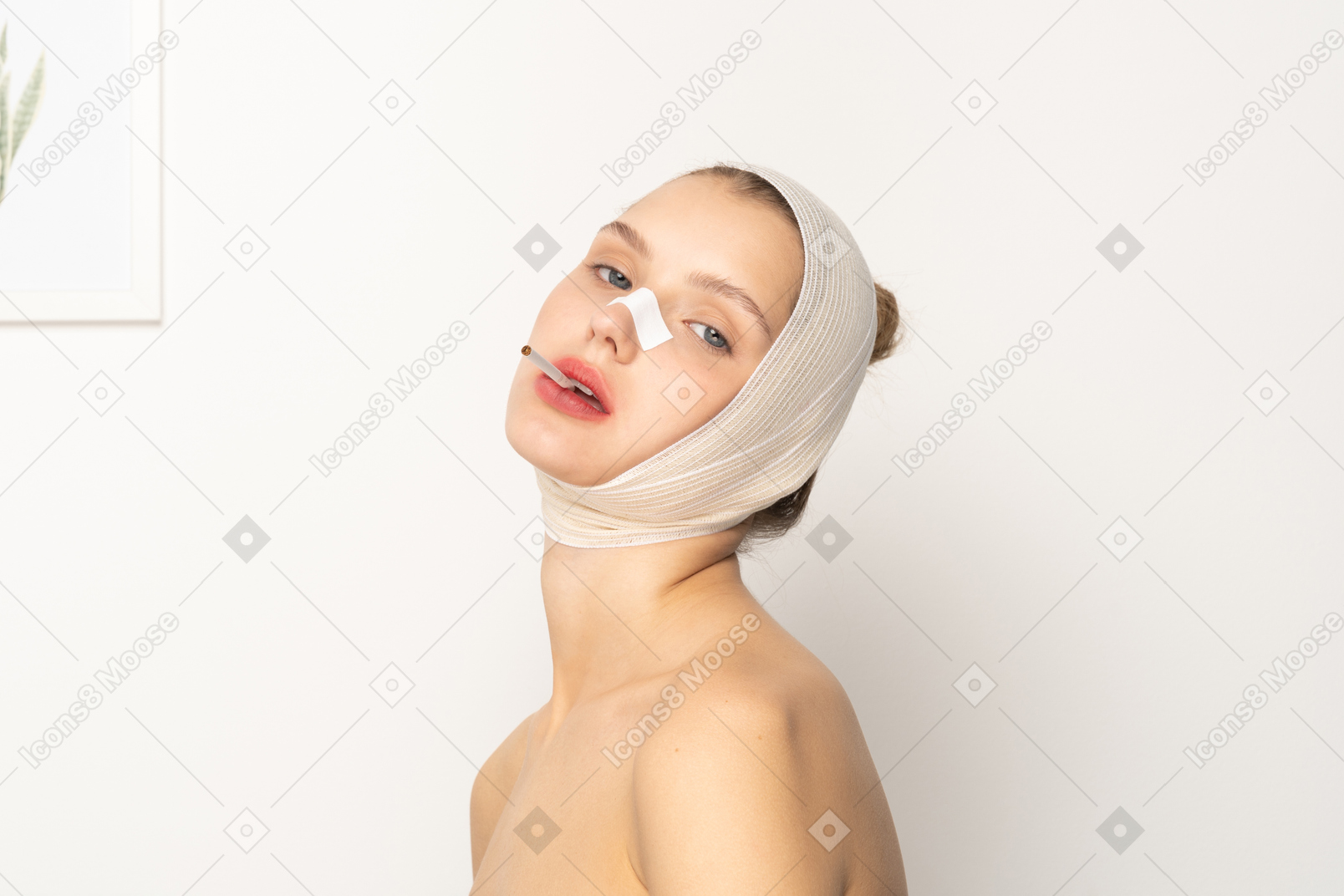 Young woman with bandaged head smoking a cigarette