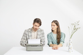 Vintage typewriters couple writing a story