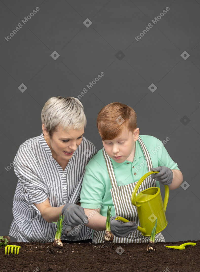 Mother and son gardening