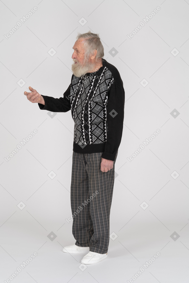 Side view of an elderly man gesturing and asking for something