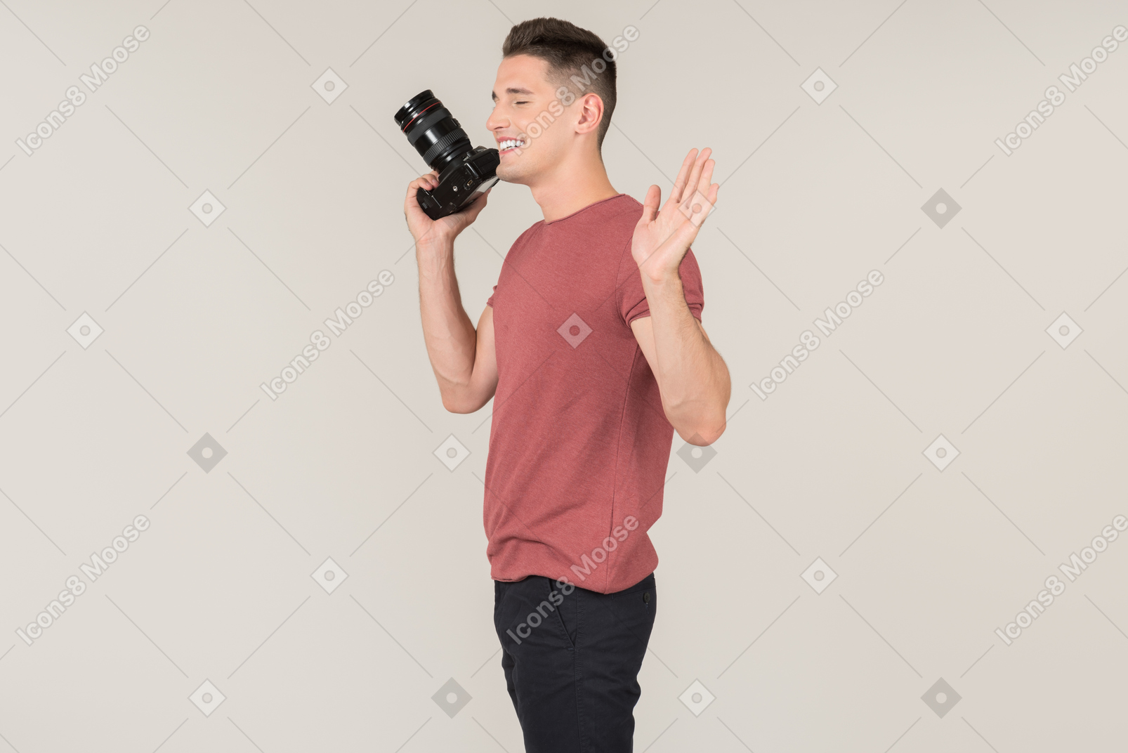 Young guy holding a photo camera