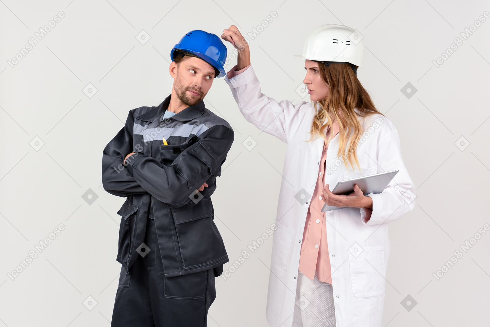 Female and male engineer colleagues discussing some work stuff