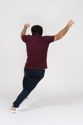 Back view of a man jumping
