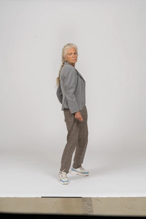 Front view of an old lady in suit