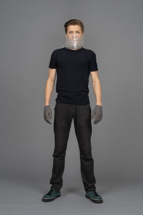 Guy in gray latex gloves on neutral background