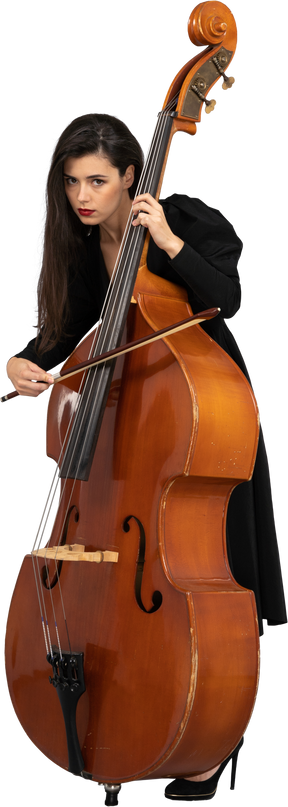 Three-quarter view of a serious young woman playing the double-bass