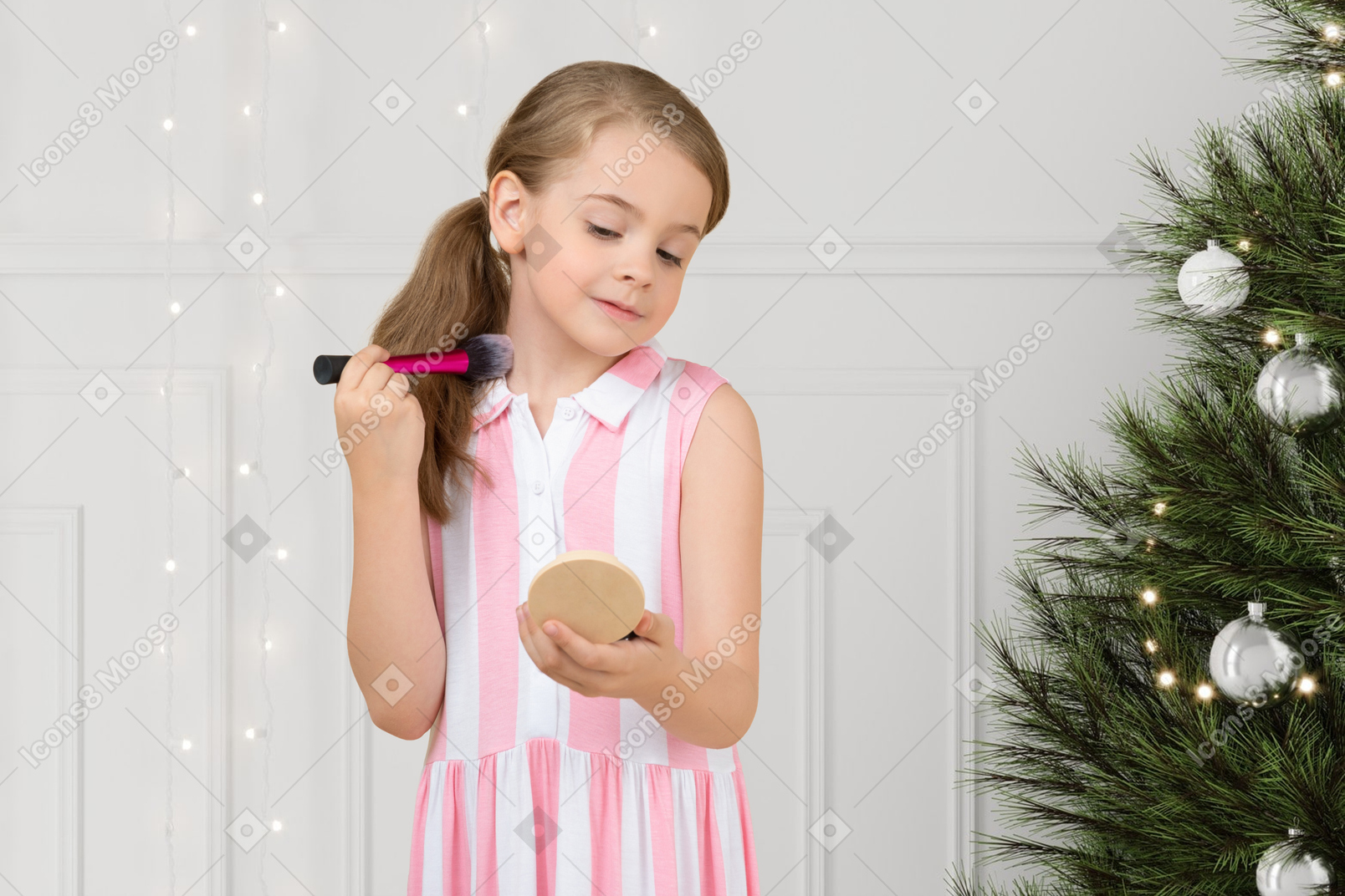 크리스마스 파티를 위해 자신을 준비하는 어린 소녀