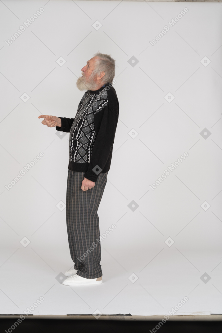 Senior man looking up and gesturing