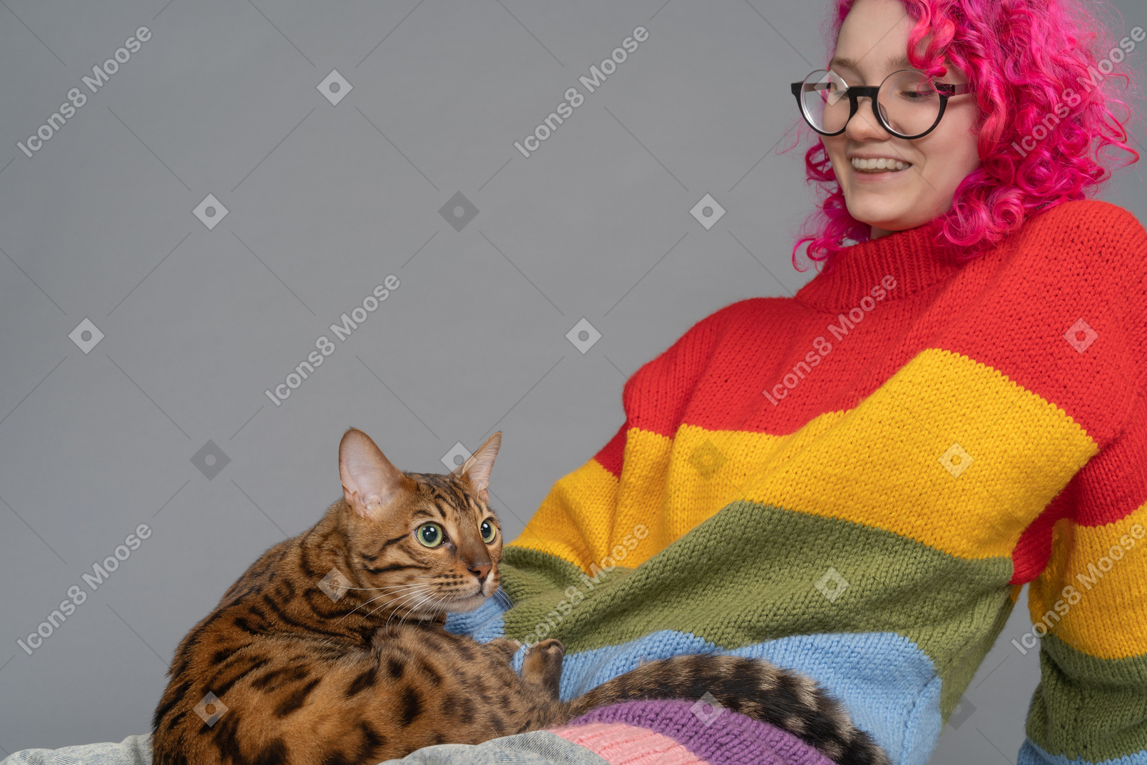 A smiling girl and her bengal cat