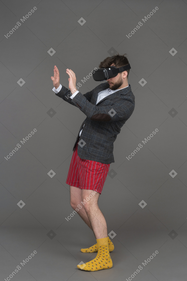 Man in vr glasses is ready to take a hit