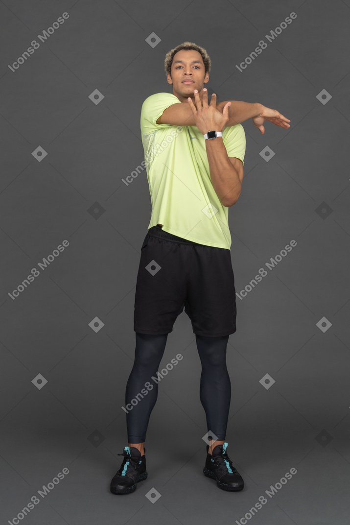 Athletic man doing stretches