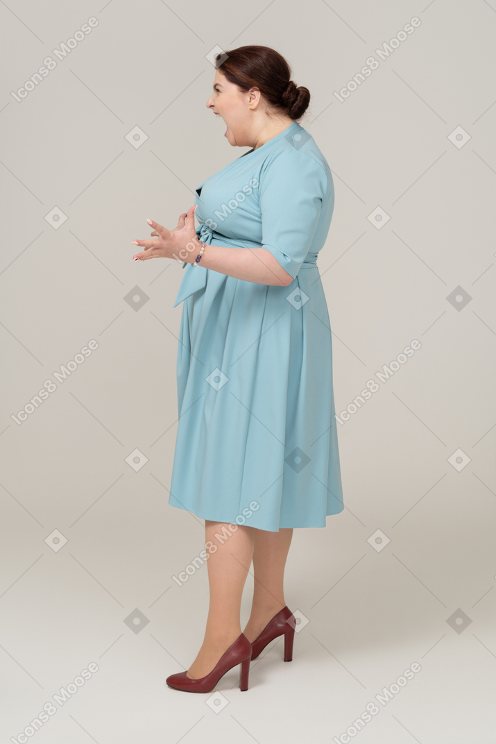 Happy woman in blue dress