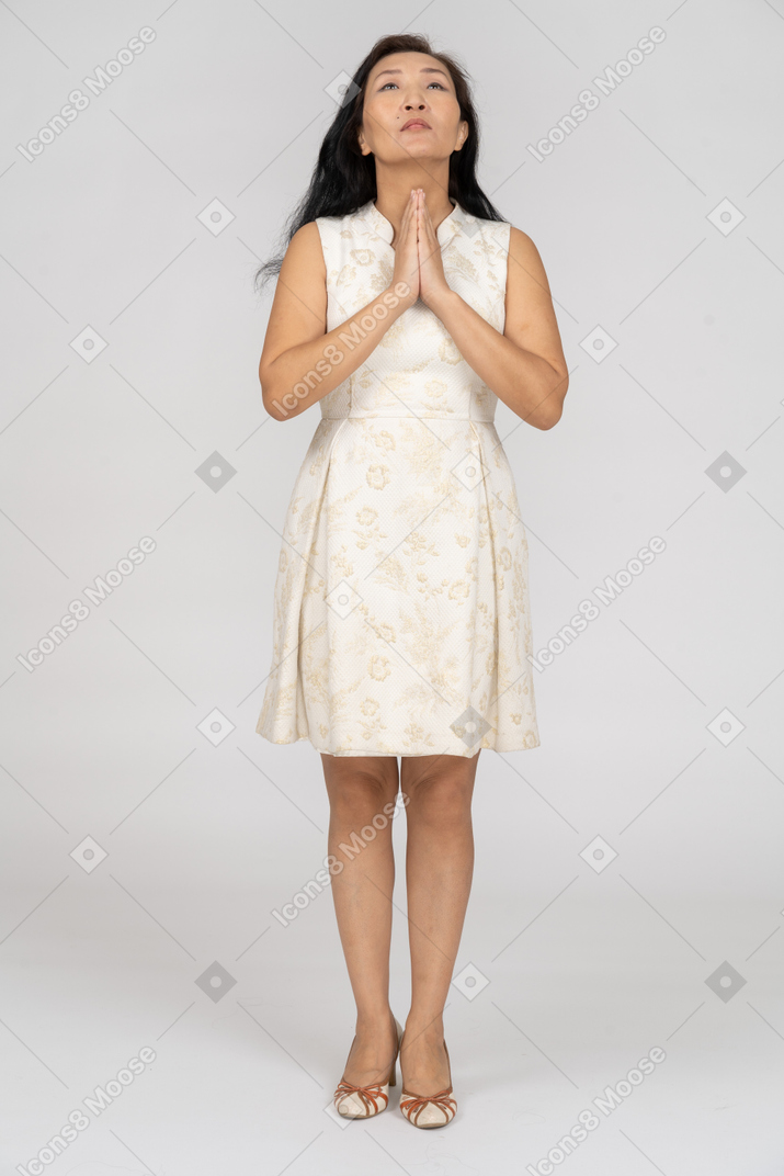 Woman in a white dress standing