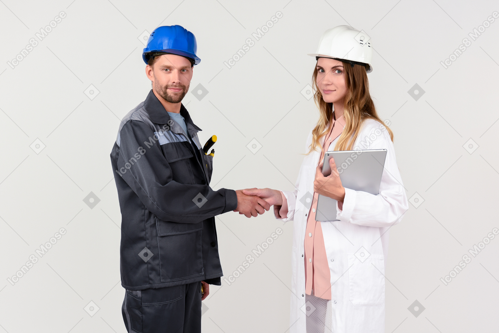Engineers shaking hands at work
