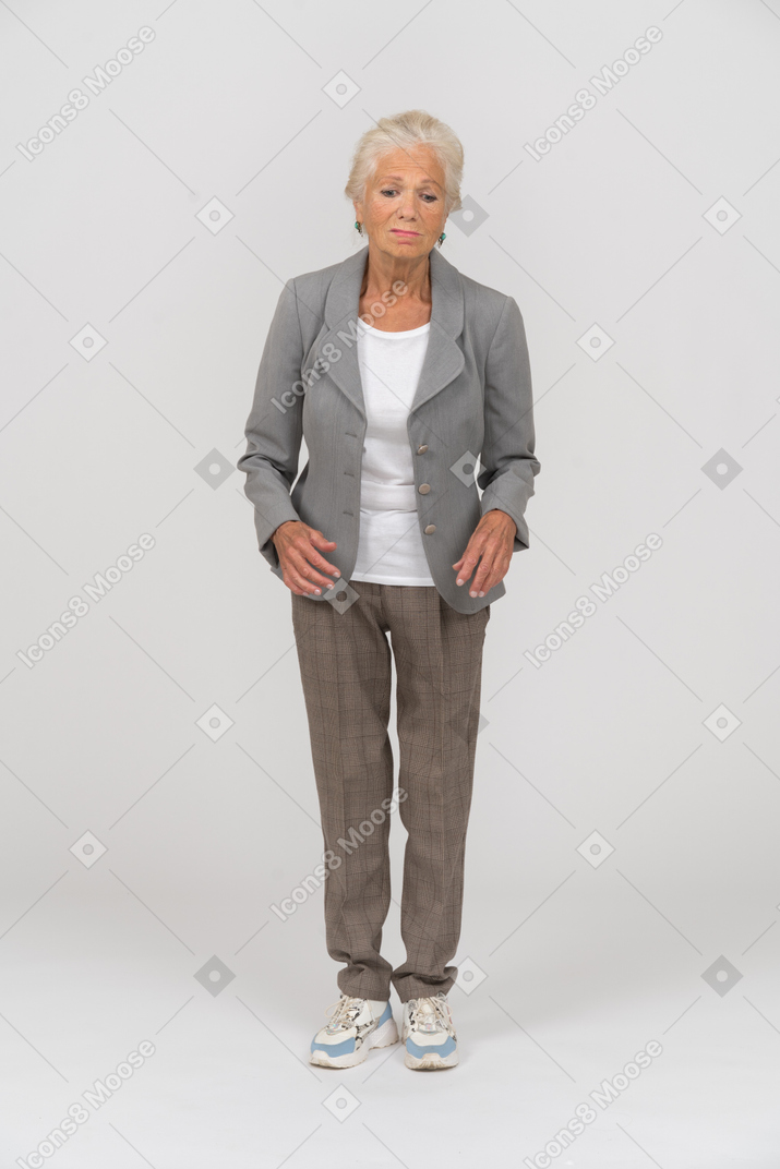 Front view of an old woman in suit