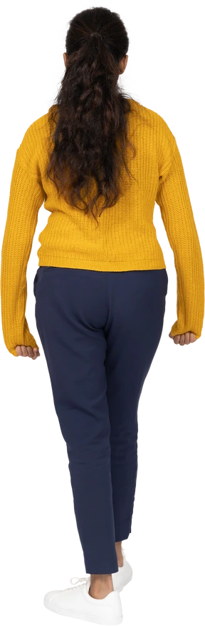 Rear view of a girl in casual clothes