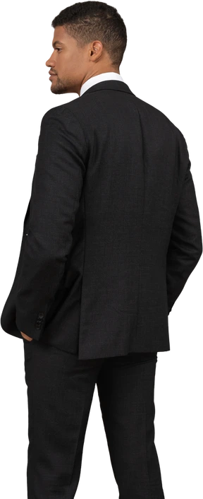 Man in black suit standing