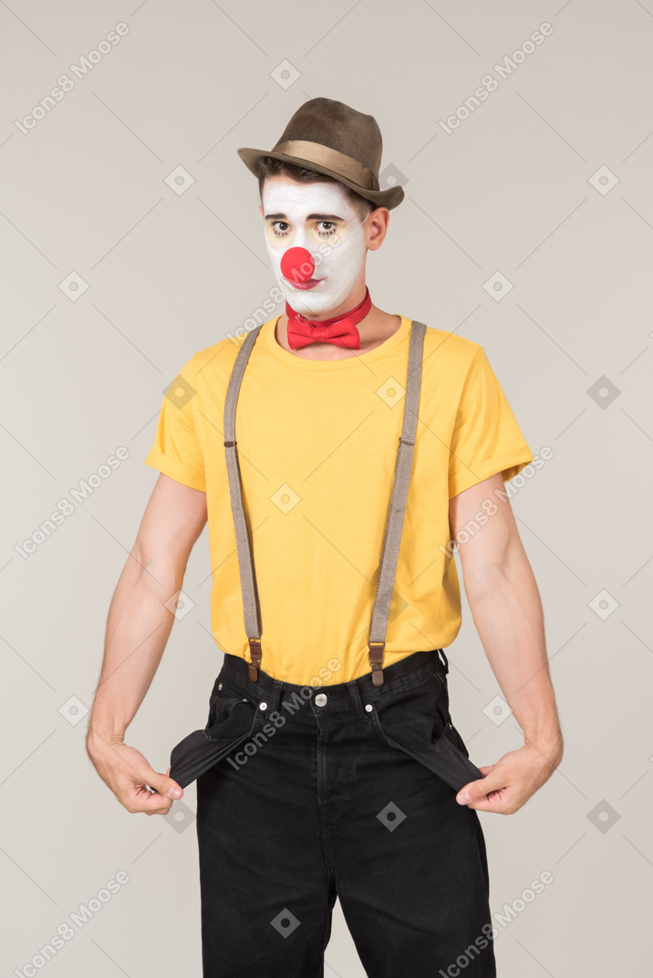 Male clown showing empty pockets