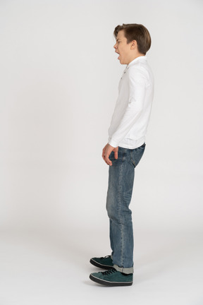 Young man in casual clothes standing