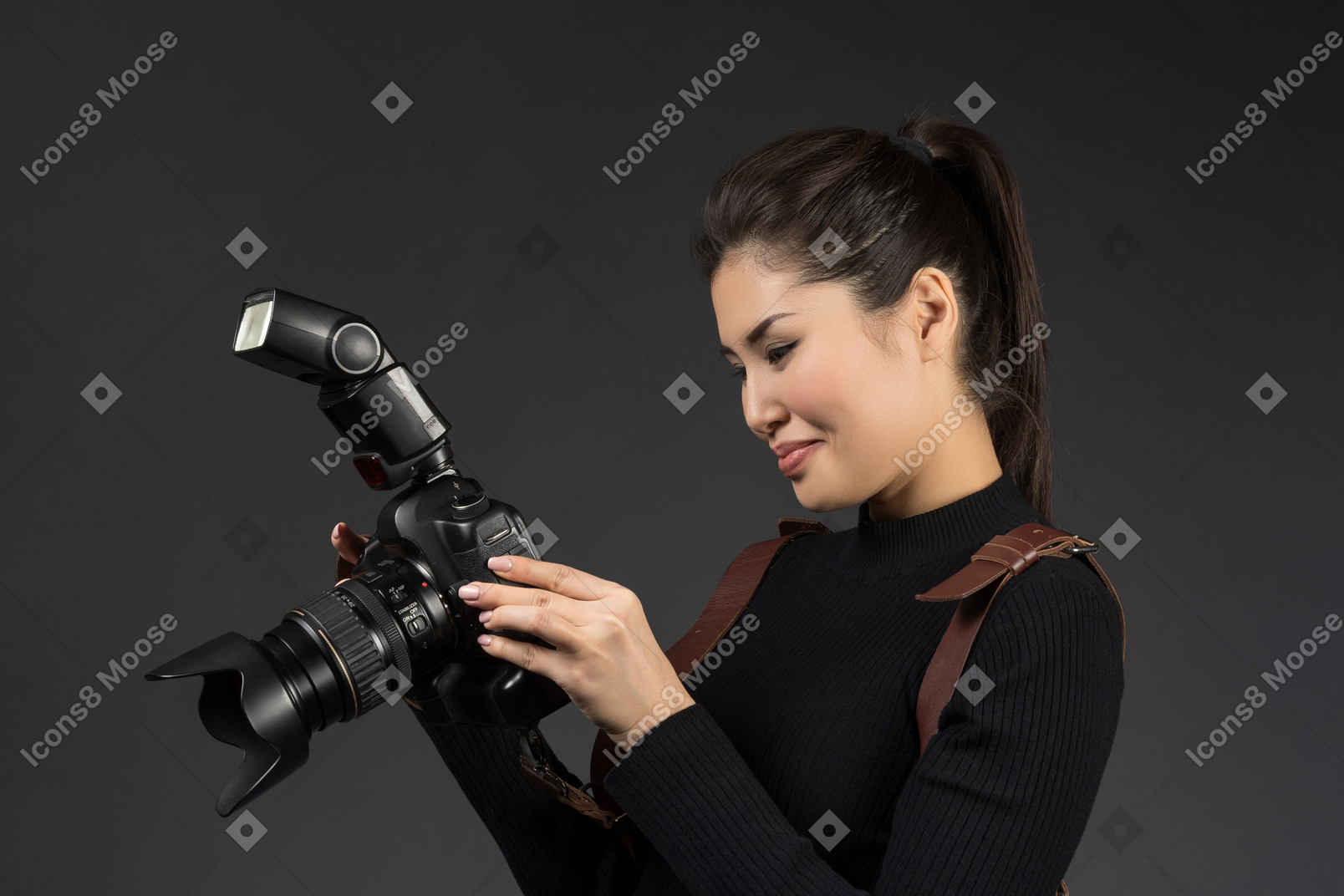 Female photographer checking snapshots