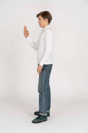 Young man in casual clothes standing