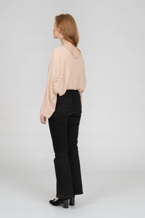Back view of young woman standing