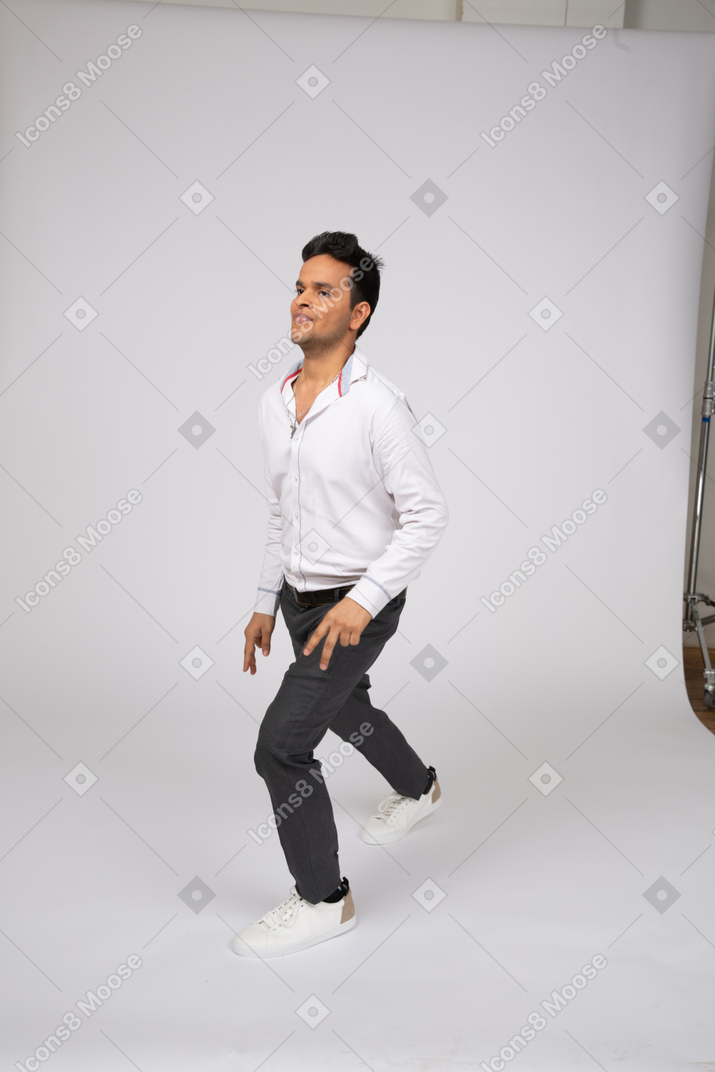 Man in white shirt walking