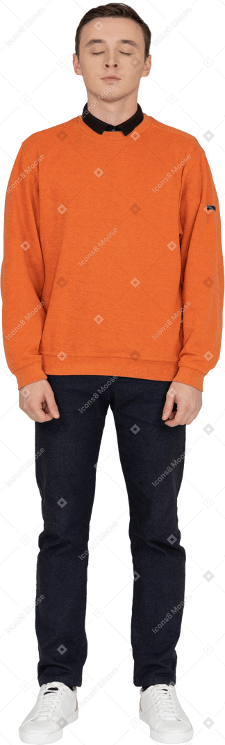 Young man in orange sweatshirt standing