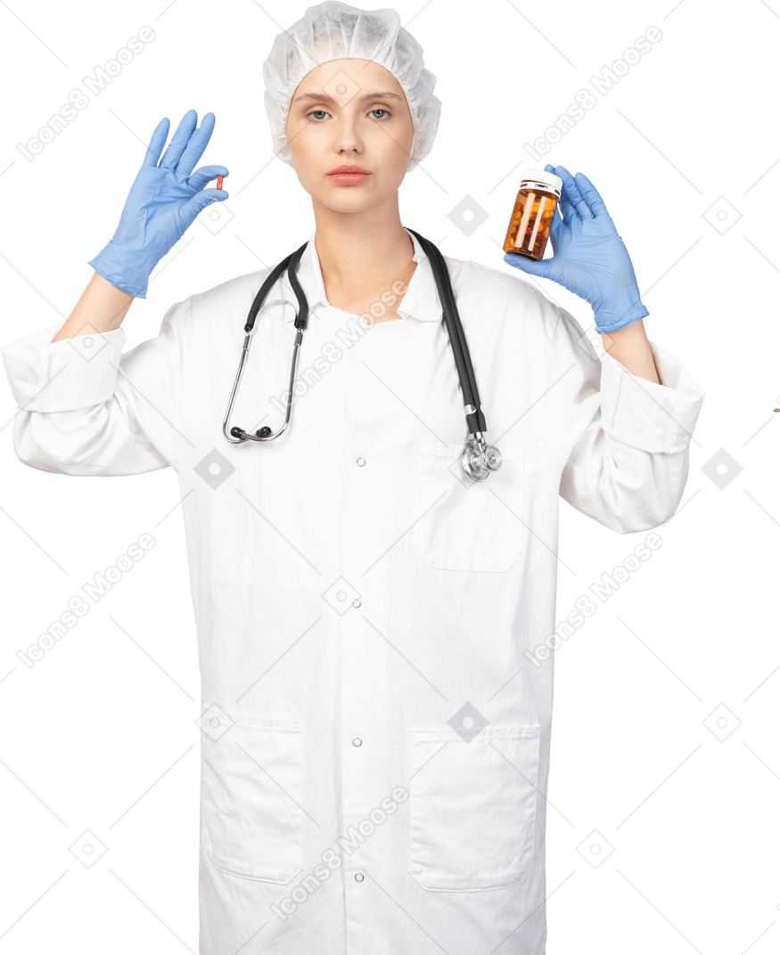 Front view of a young female doctor choosing between pills