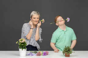 Mother and son making bouquet
