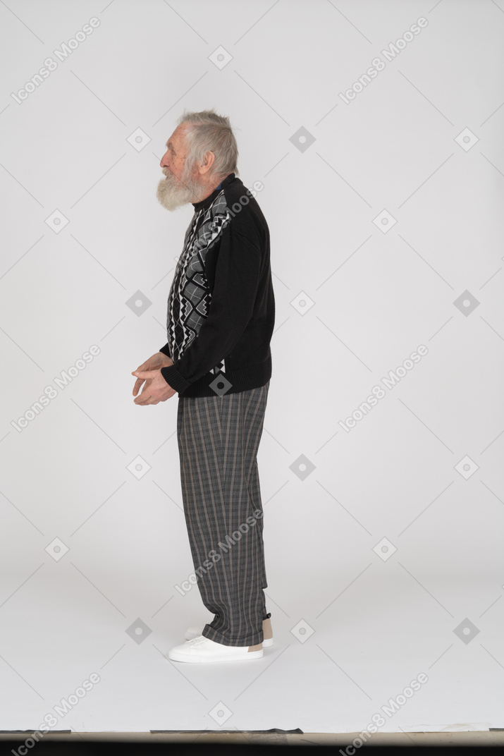 Side view of an old man gesturing