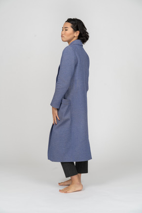 Back view of an upset woman in coat