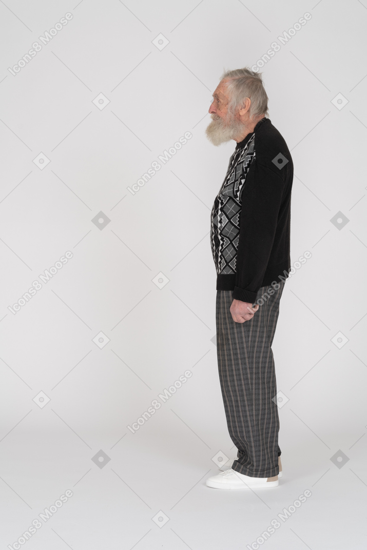 Side view of an old bearded man standing