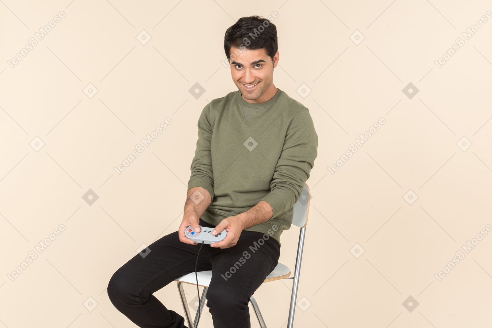 Young caucasian guy playing a videogame