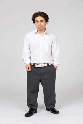 Young man in white shirt looking at camera