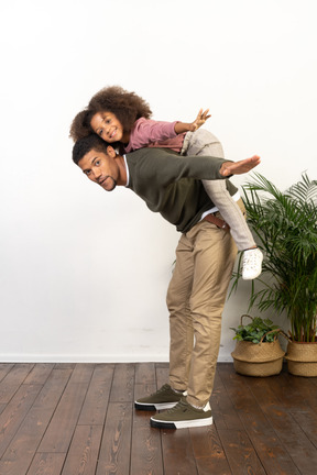 Good looking young man playing with a girl