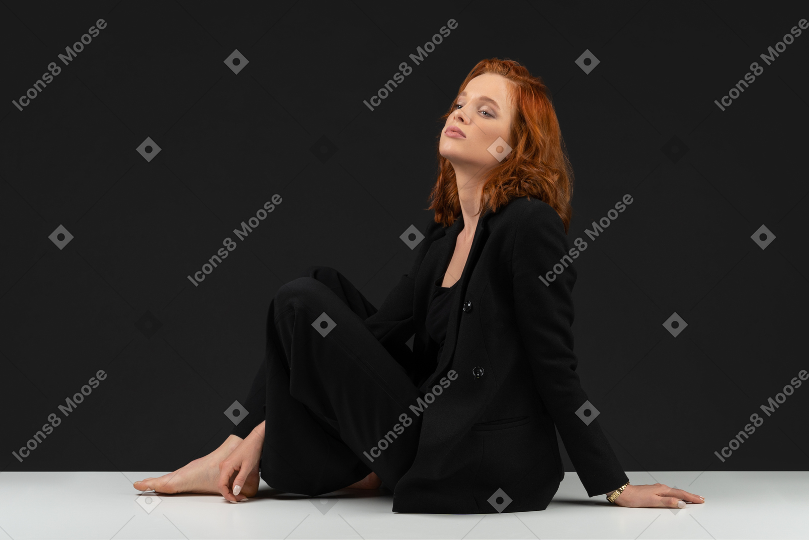A side view of the beautiful woman sitting on the table with closed eyes