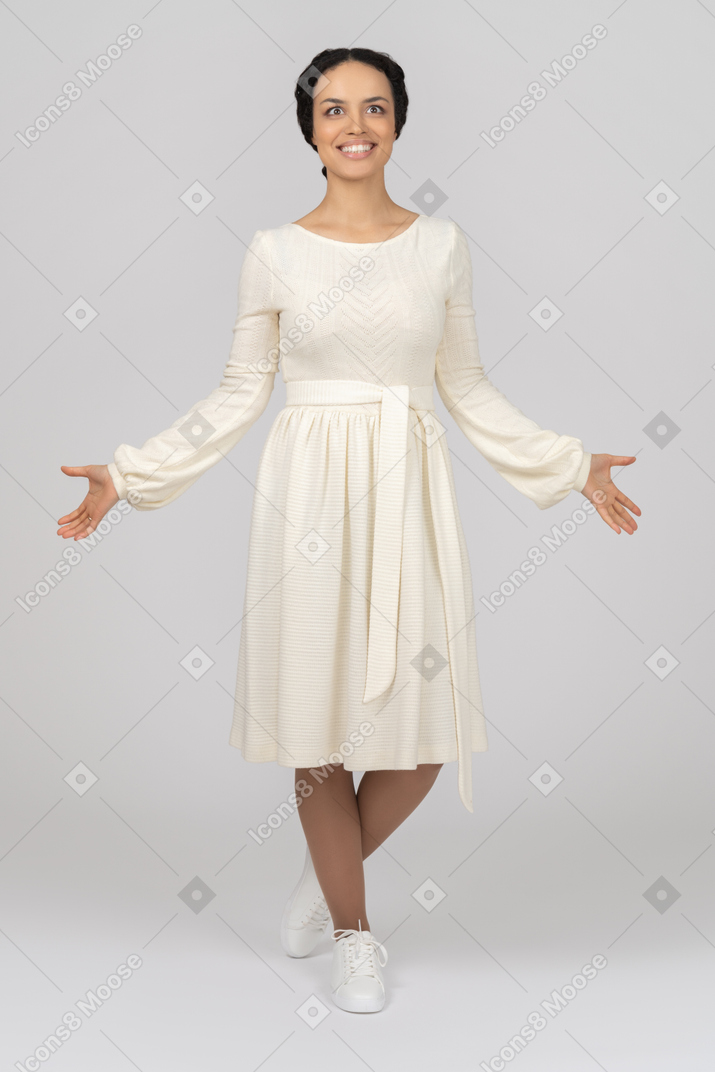 Happy young woman holding arms out