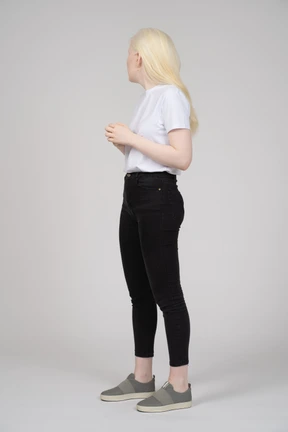Three-quarter view of a young woman looking away from camera